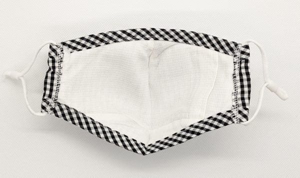 Inside view of a kids mask - colour is plaid black and white. Shows inside pocket filter